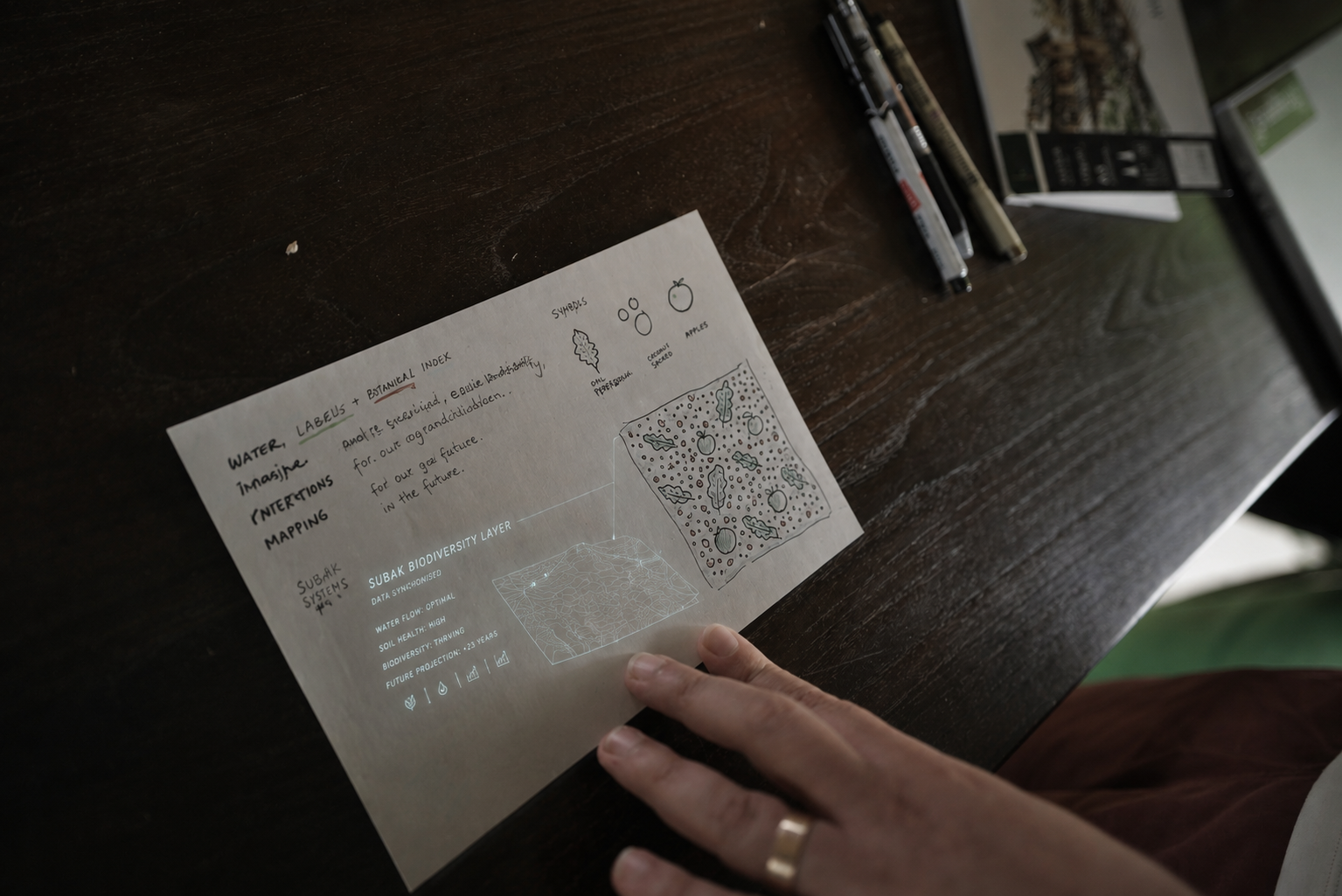 A participant developing a batik motif of the future